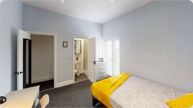 Bright, modern ensuite bedroom with chic decor...