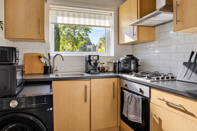 Sunlit Modern Oak Kitchen with Coffee Corner.png