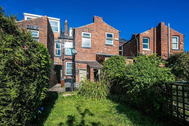 Sunny private rear garden with lawn, mature hed...