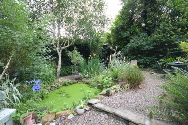 Rear garden pond and seating area