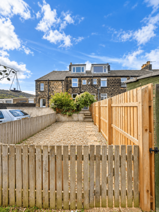 Sunny Stone Terrace Garden with Gravel Yard