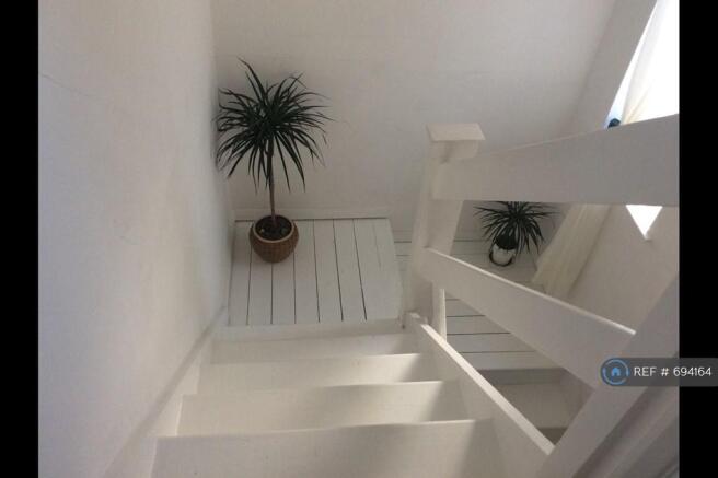 Stairwell With a Beach Home Holiday Feel