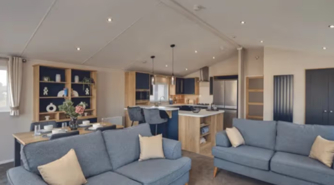 Open Plan Lounge With Blue Sofas, Dining Area And