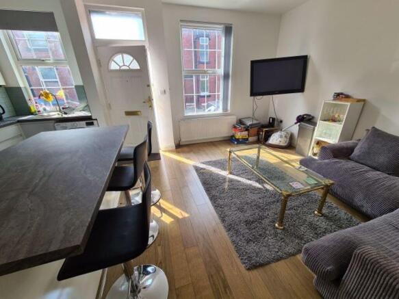 A bright and inviting living room featuring a m...