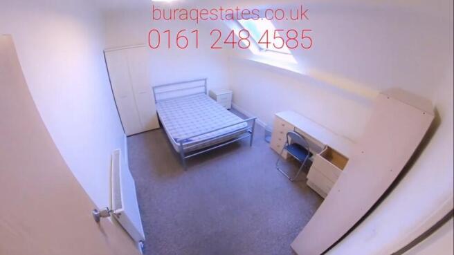 Bright, simply furnished double bedroom with a ...