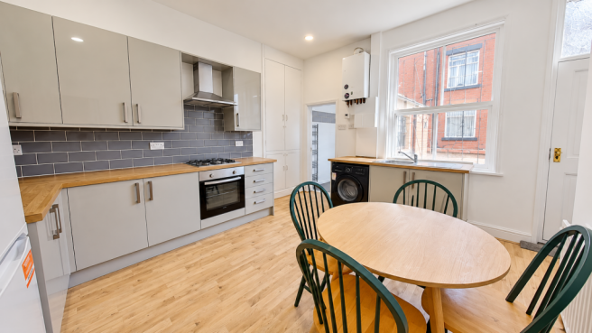 Modern Kitchen with Green Dining Chairs