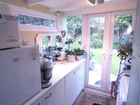 Utility/Laundry Room Leading To Garden