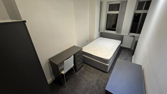 Bright modern bedroom with dedicated study desk...