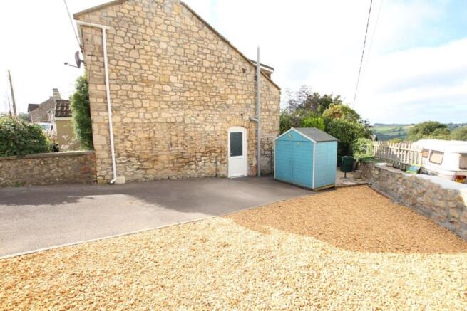 Rear Courtyard And Side Garden