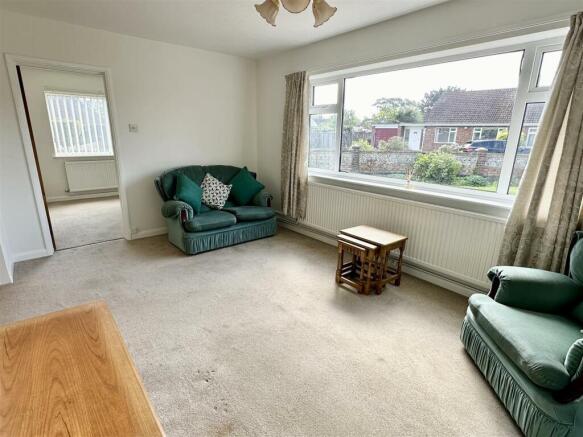 sitting room leading to bedroom three.JPEG