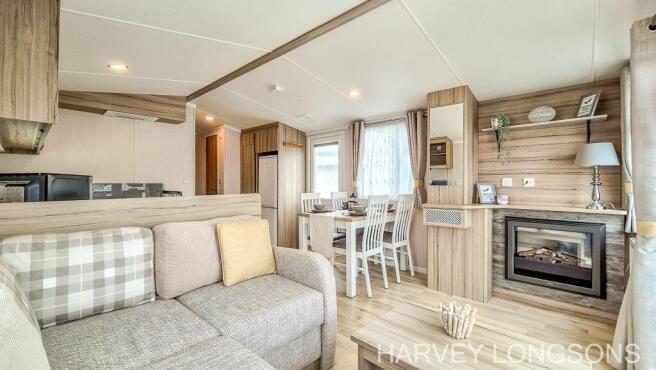 Spacious lounge diner with feature fireplace in th
