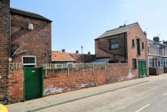 Outside - Two storey brick garage/store