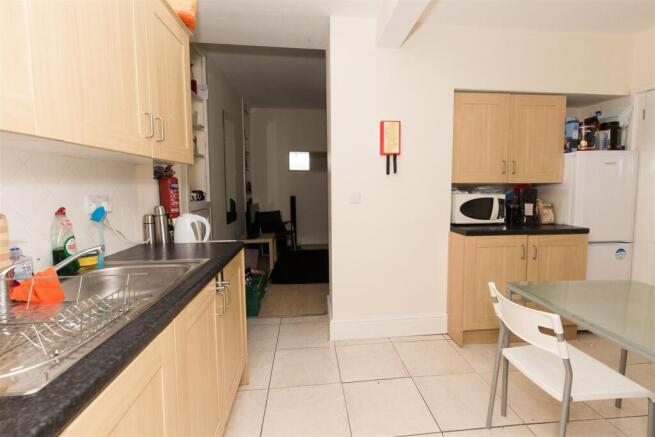 Bright kitchen with ample storage and dining ar...