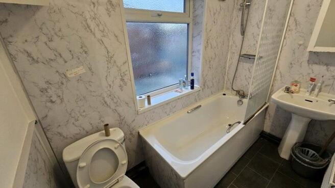 Bright and clean bathroom featuring a full-size...