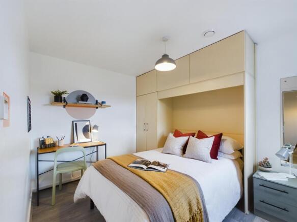 A spacious and well-presented master bedroom fe...