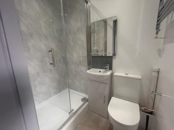 Modern bathroom with shower and basin...