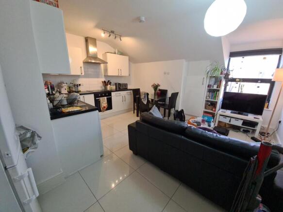 Open-plan living area with modern kitchen...