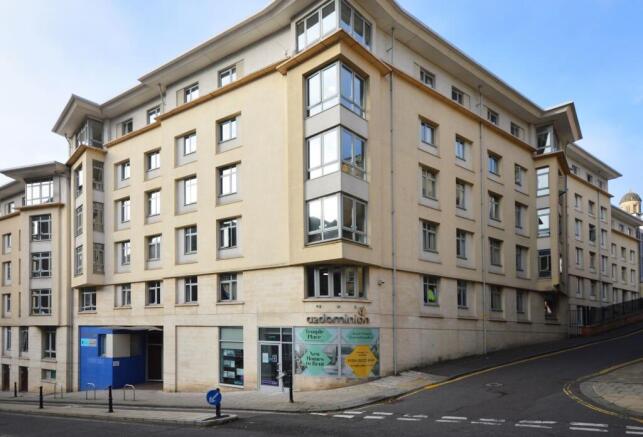 Modern corner apartment building with bay windo...