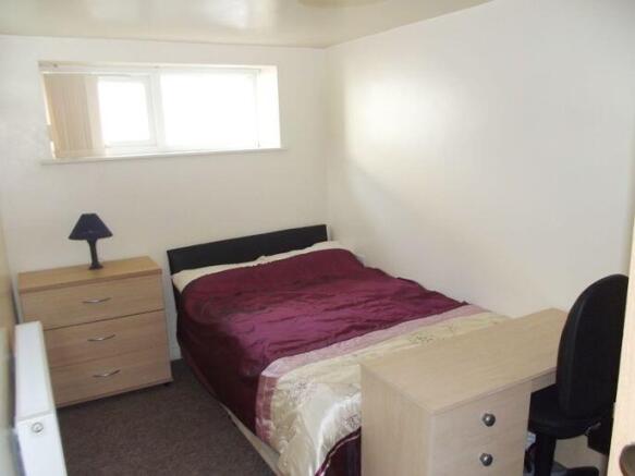 Cozy double bedroom with a double bed, bedside ...