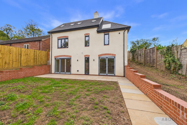 Cleared rear garden with natural soil.png