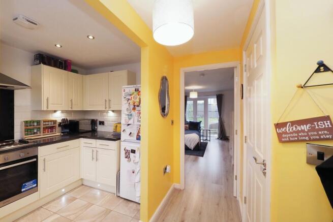 Welcoming entrance with great view of kitchen and lounge