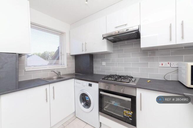 Kitchen With Oven And Washing Machine