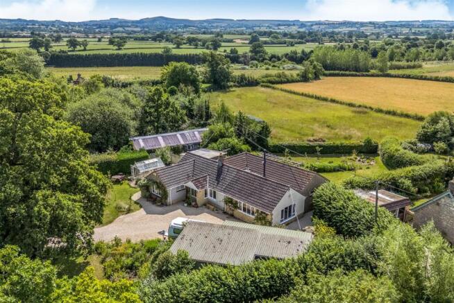 Aerial including field behind