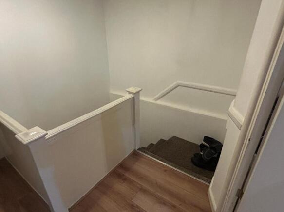 Well-maintained internal staircase with neutral...