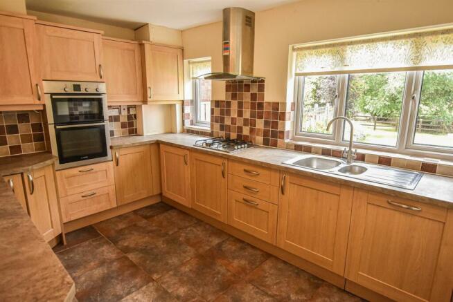 12 The Village - kitchen (brochure).jpg