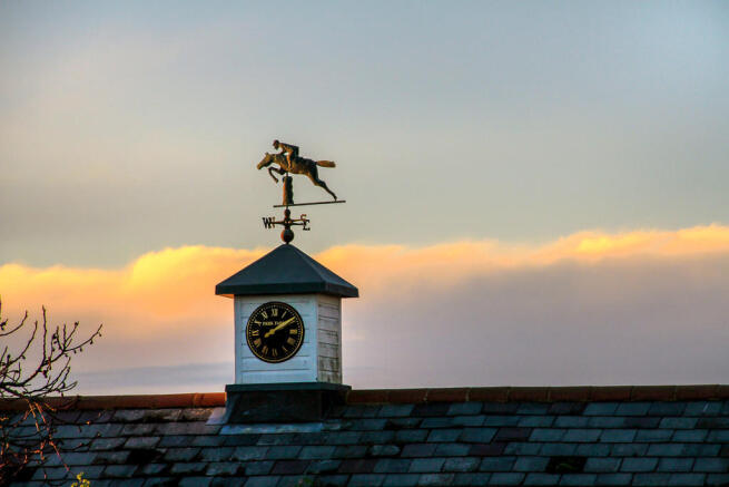 Weather vane and clock