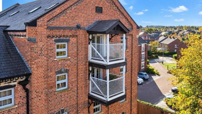 Red Brick Balconies Under Blue Skies.jpg