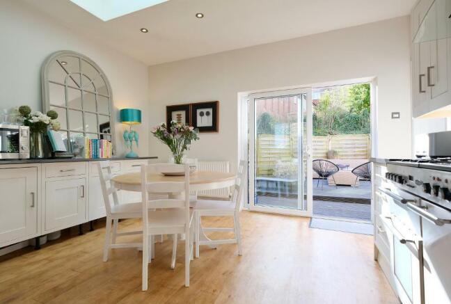 Sun-filled kitchen leading to the deck