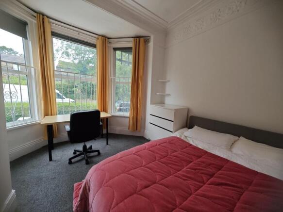 Bright and inviting master bedroom featuring a ...