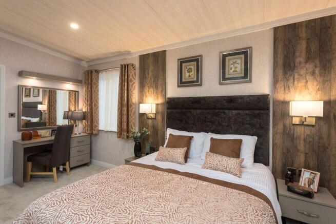 Luxury Main Bedroom With Feature Wall And Dressing