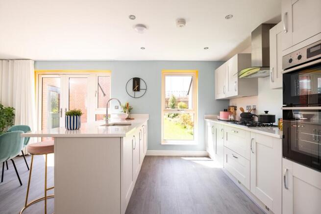 Modern kitchen with ample storage space and sociable breakfast bar
