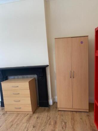 Bright bedroom with ample storage and character...