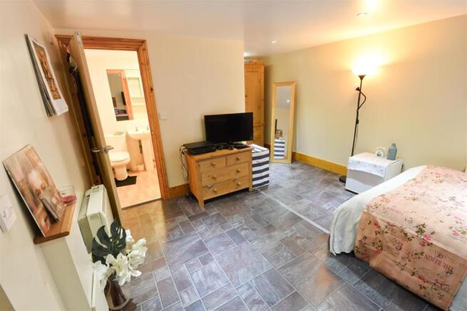 Spacious bedroom with private ensuite access...