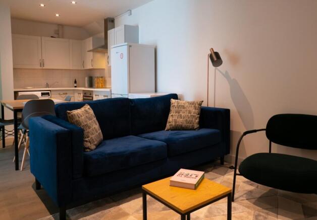 A stylish and spacious modern living room featu...