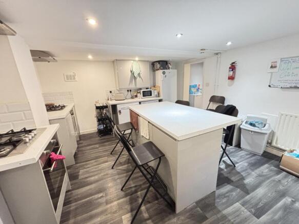Bright, modern communal workspace with a large ...