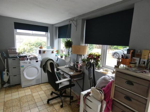 SPACIOUS SIDE PORCH/UTILITY ROOM