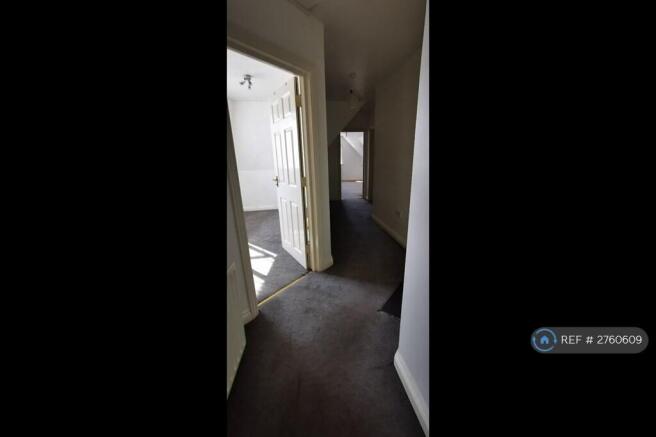 Corridor To Medium Size Bedroom Facing East