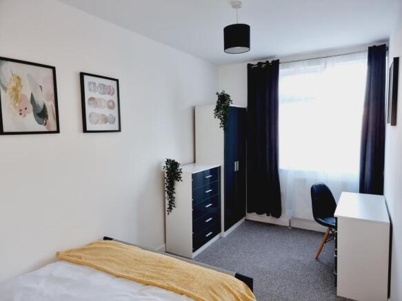 Bright and inviting double bedroom featuring mo...
