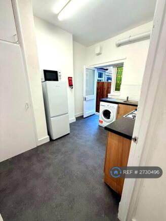 Large Kitchen And Exit To Garden