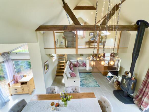 living space with vaulted ceilin