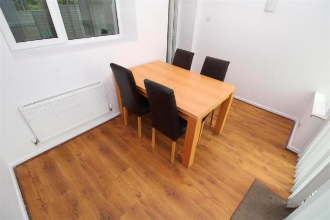 Bright dining area with stylish wooden flooring...