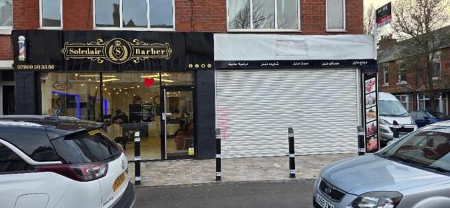 Street-facing shopfront with modern barber...