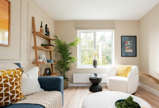 A light filled living area featuring double doors to the garden