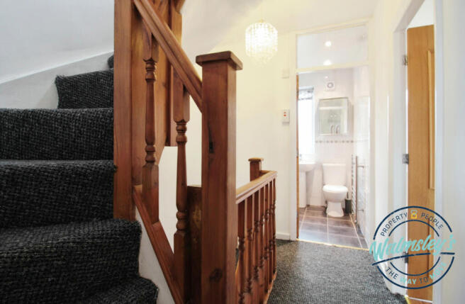 Staircase rising to first floor