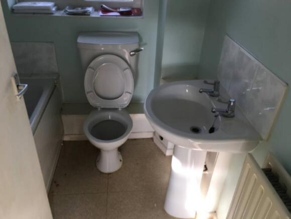 Bathroom bath with overhead shower