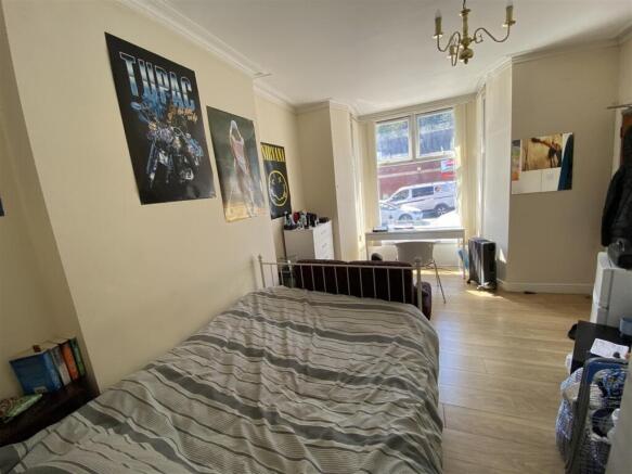 Spacious bright bedroom with large study desk...